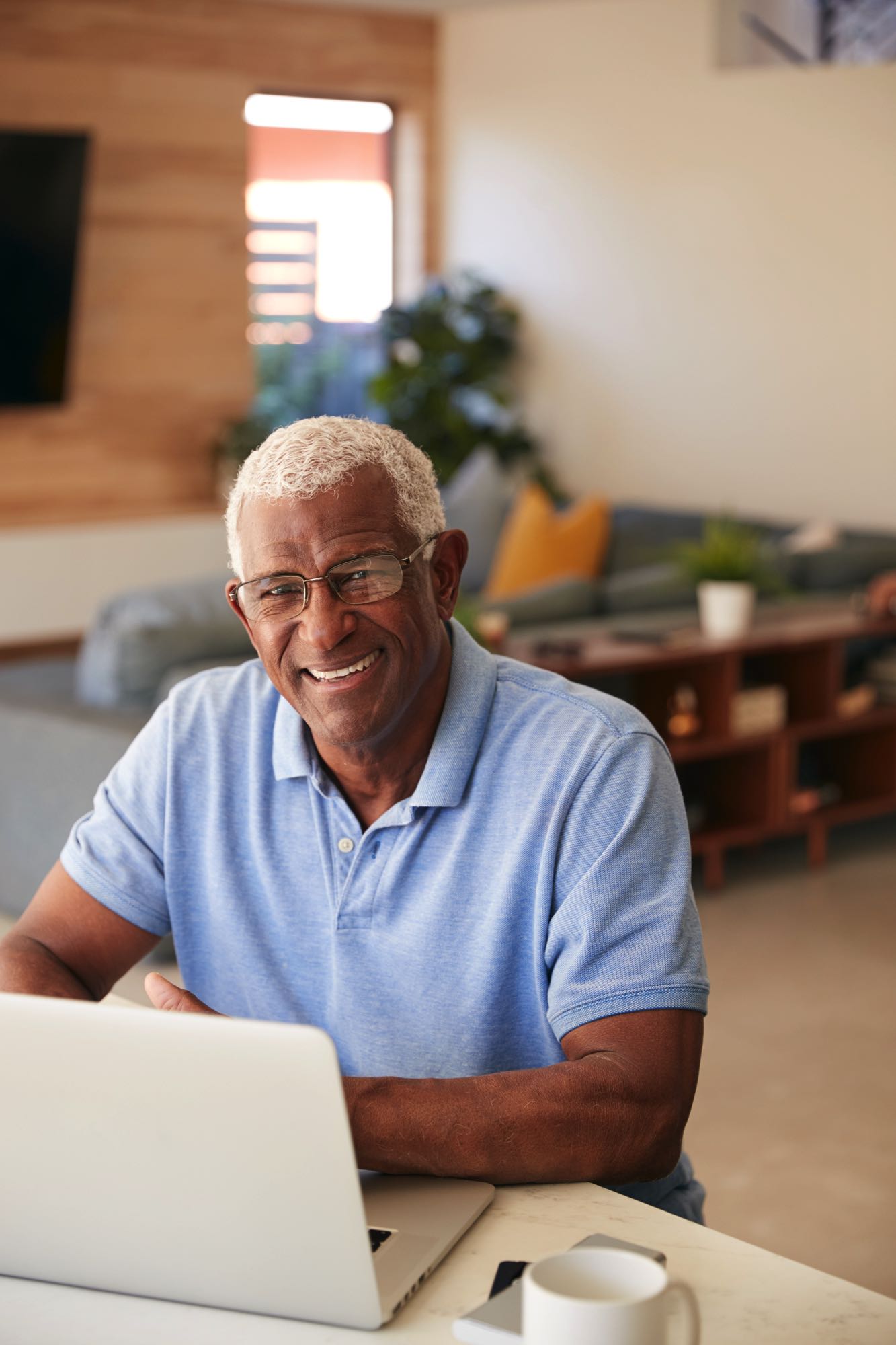 portrait-of-senior-african-american-man-using-lapt-T45PUPA.jpg